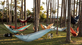 A family all relaxing in different hammocks together  Nakie - Australia