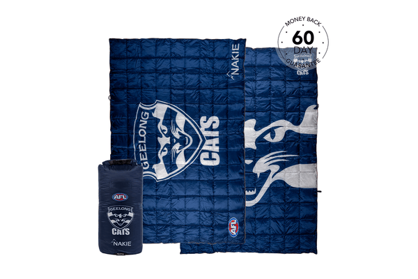 Navy quilted down blanket featuring Geelong Cats AFL logo and branding, shown unrolled with packable carry bag