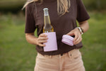 Dusty pink insulated coffee cup with matching lid, held by person carrying beer bottle outdoors preview #8