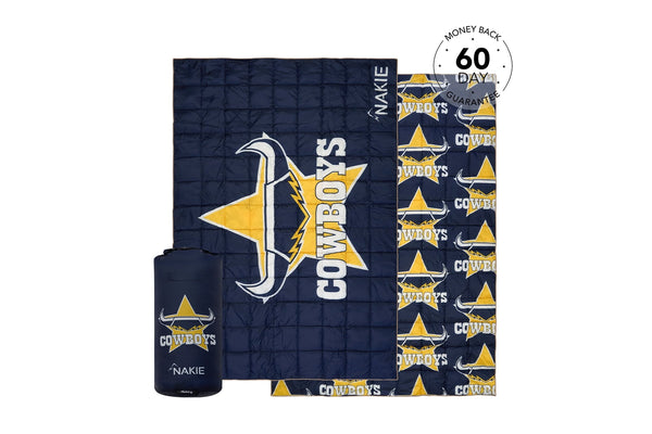 Navy Cowboys puffy blanket with gold star and horns logo, shown unrolled with matching compact carrying pouch