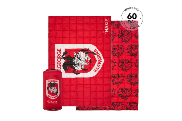 Red quilted puffy blanket with St George Illawarra Dragons logo and black dragon pattern, includes matching stuff sack.