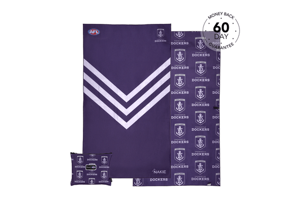Purple Fremantle Dockers beach towel with white chevron stripe and anchor logo pattern, displayed flat with matching pillowca