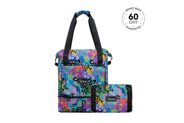 Colorful abstract patterned tote bag with black handles and matching small pouch, front view.
