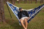 Man sitting in a Nakie NRL Bulldogs patterned hammock outdoors. preview #5