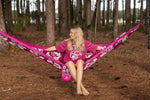 Person sitting in a Manly Sea Eagle NRL Nakie Hammock in a forest setting preview #4