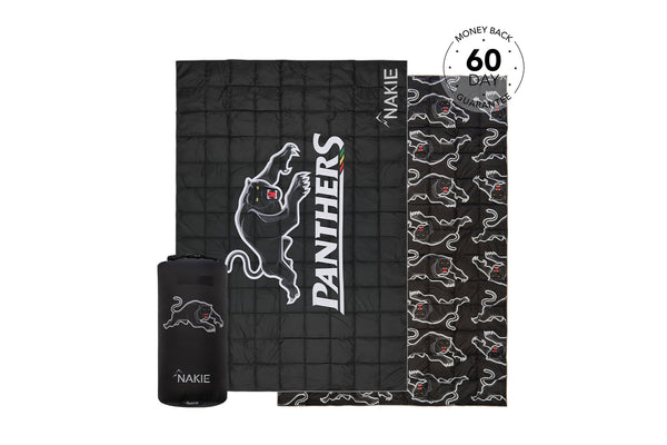 Black quilted puffy blanket with Panthers logo and repeating bull pattern, includes matching carry bag.