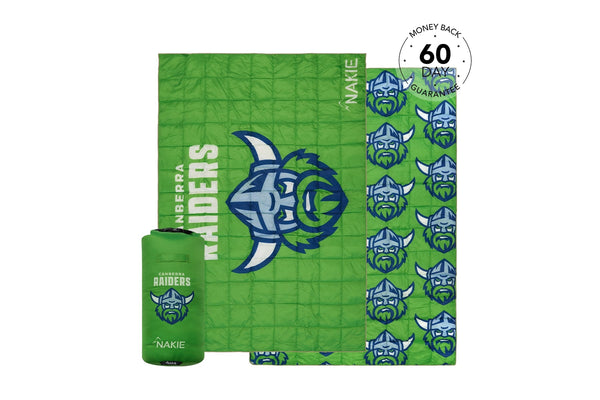 Green quilted puffy blanket with Canberra Raiders logo and repeated viking mascot heads