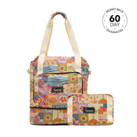 Retro Shores recycled tote bag with cream handles, multicolor patchwork beach-themed print, front pocket, and matching pouch.