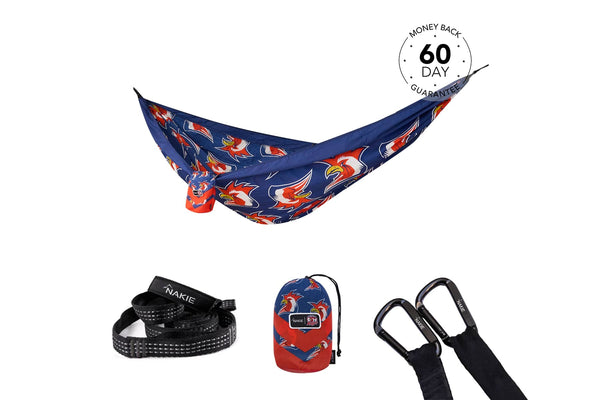 Navy recycled hammock with red rooster print, includes black straps and carabiners, displayed with stuff sack
