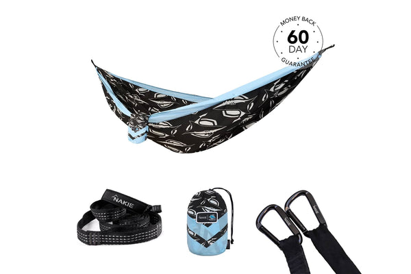 Black and white leaf-patterned camping hammock with light blue straps, displayed with matching carabiners and stuff sack.