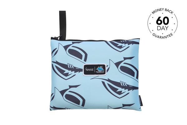 Light blue pouch with black shark print pattern and black carry strap, Nakie brand label visible