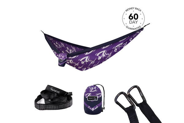 Purple and navy recycled hammock with geometric pattern, displayed with black straps, carabiners, and storage pouch